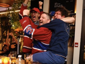 Martin, Hugues and Patrick celebrate the Canadiens scoring a goal to put the team up 2-0 in Game 5 at Social Verdun on June 22, 2021.