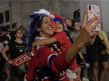 Melanie Manna and daughter Serafina watch fireworks in front of the Bell Centre as the Montreal Canadiens and the Vegas Golden Knights played in Game 6 of the third round of the NHL playoff series.