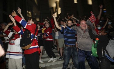 Montreal Canadiens fans celebrate  in front of the Bell Centre after the Habs defeated the Vegas Golden Knights June 24, 2021.