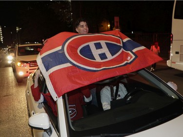 Montreal Canadiens fans celebrate in downtown Montreal after the Habs defeated the Vegas Golden Knights June 24, 2021.