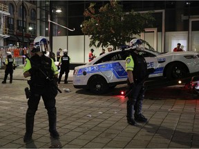 A trashed police car is taken away from in front of the Bell Centre, where the Montreal Canadiens defeated the Vegas Golden Knights in Game 6 in Montreal on June 24, 2021.