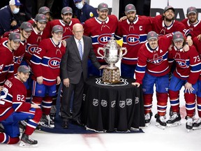 The Canadiens pose with the Clarence Campbell Bowl after beating the Vegas Golden Knights 3-2 in overtime in Game 6 of their semifinal series at the Bell Centre to clinch a spot in the Stanley Cup final.