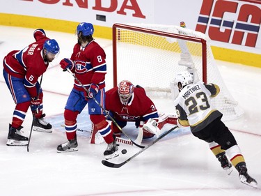 Vegas Golden Knights defenseman Alec Martinez (23) finds a rebound off Carey Price (31) and scores to tie the game 2-2 during NHL semi final game 6 in Montreal on Thursday, June 24, 2021.