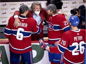 Montreal Canadiens general manager Marc Bergevin congratulates defenceman Shea Weber, centre Eric Staal defenceman Jeff Petry after the Canadiens defeated the Vegas Knights to advance to the Stanley Cup final on June 24, 2021.