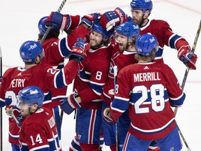 Canadiens players celebrate after beating the Vegas Golden Knights 3-2 in overtime in Game 6 of semifinal series Thursday night at the Bell Centre, earning a spot in the Stanley Cup final.