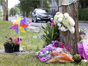 Flowers mark the spot where 15-year-old Angelica John was struck and killed by a car last month.
