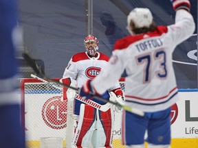 Canadiens goalie Carey Price leaves his net while teammate Tyler Toffoli looks on following 3-1 win over the Maple Leafs in Game 7 of first-round playoff series Monday night in Toronto.