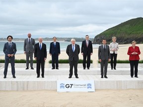 G7 leaders pose for the official family photo during the G7 Summit on June 11, 2021, in Carbis Bay, Cornwall.