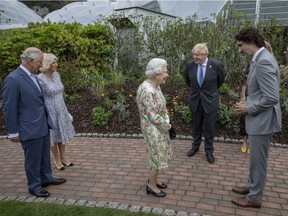 Prince Charles, Prince of Wales, Camilla, Duchess of Cornwall, British Prime Minister Boris Johnson, wife Carrie Johnson, Queen Elizabeth II and Canadian Prime Minister Justin Trudeau chat at a drinks reception for Queen Elizabeth II and G7 leaders at The Eden Project during the G7 Summit on June 11, 2021 in St Austell, Cornwall, England.