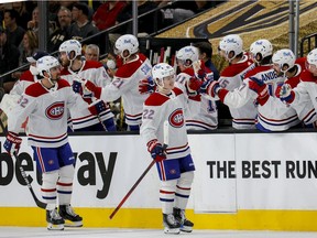 The Canadiens’ Cole Caufield (22) is congratulated after scoring his first NHL playoff goal in 4-1 loss to the Golden Knights Monday night at T-Mobil Arena in Las Vegas in Game 1 of Stanley Cup semifinal series.
