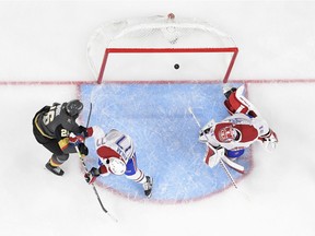 The Golden Knights’ Mattias Janmark (26) scores on Canadiens goalie Carey Price while being checked by defenceman Brett Kulak in Game 1 of Stanley Cup semifinal series Monday night in Las Vegas.