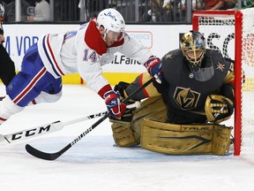 LAS VEGAS, NEVADA - JUNE 14:  Nick Suzuki #14 of the Montreal Canadiens trips over Marc-Andre Fleury #29 of the Vegas Golden Knights as he defends the net in the third period in Game One of the Stanley Cup Semifinals during the 2021 Stanley Cup Playoffs at T-Mobile Arena on June 14, 2021 in Las Vegas, Nevada. The Golden Knights defeated the Canadiens 4-1.