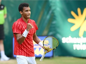 Félix Auger-Aliassime of Montreal celebrates after winning his match against Roger Federer of Switzerland in the Noventi Open at OWL-Arena on June 16, 2021, in Halle, Germany.