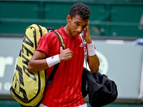 Félix Auger-Aliassime of Canada looks dejected after losing his match against Ugo Humbert of France during day 8 of the Noventi Open at OWL-Arena on June 19, 2021 in Halle, Germany.
