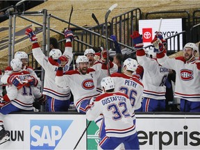 The Canadiens celebrate a goal by Cole Caufield (not pictured) against the Vegas Golden Knights during the second period in Game 5 at T-Mobile Arena in Las Vegas on June 22, 2021.