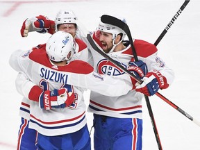Nick Suzuki #14 of the Montreal Canadiens celebrates with Eric Staal #21, and Jake Allen #34 after Staal's goal against the Vegas Golden Knights during the second period in Game Five of the Stanley Cup Semifinals at T-Mobile Arena on June 22, 2021 in Las Vegas, Nevada. The Canadiens beat the Golden Knights 4-1.