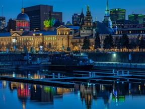 Montreal's Bonsecours Market is reflected at the yacht club in the Old Port on Saturday April 25, 2020. Dave Sidaway / Montreal Gazette