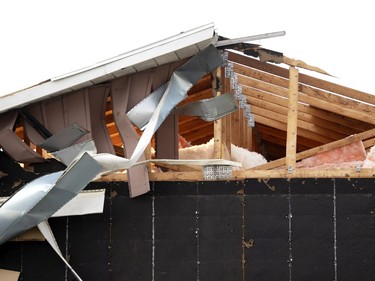 A damaged home after a tornado struck in Mascouche north of Montreal on Monday, June 21, 2021.