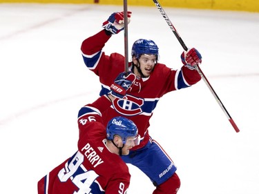 Jesperi Kotkaniemi (15) and Corey Perry (94) celebrate Shea Weber's (6) goal against Vegas Golden Knights goaltender Robin Lehner (90) during NHL semi final game 6  in Montreal on Thursday, June 24, 2021.