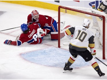 Montreal Canadiens defenseman Ben Chiarot (8) collides with Carey Price (31) while blocking a shot during NHL semi final game 6 against the Vegas Golden Knights in Montreal on Thursday, June 24, 2021.