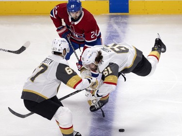 Vegas Golden Knights Mark Stone (61) and Max Pacioretty (67) try to strip the puck from Phillip Danault (24) during NHL semi final game 6  in Montreal on Thursday, June 24, 2021.