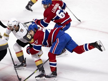 Phillip Danault (24) gets pulled off balance by Vegas Golden Knights center Chandler Stephenson (20) during NHL semi final game 6  in Montreal on Thursday, June 24, 2021.