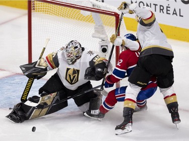 Artturi Lehkonen (62) gets muscled down by Vegas Golden Knights defenseman Alex Pietrangelo (7) as he shoots on goaltender Robin Lehner (90) during NHL semi final game 6  in Montreal on Thursday, June 24, 2021.