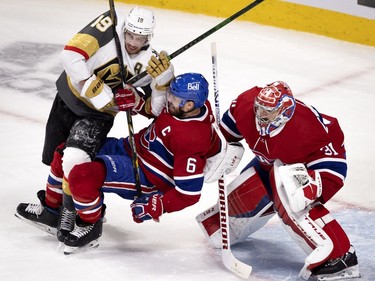 Vegas Golden Knights right wing Reilly Smith (19) and Shea Weber (6) tussle in front of Montreal Canadiens goaltender Carey Price (31) during NHL semi final game 6  in Montreal on Thursday, June 24, 2021.