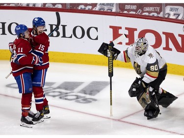 Brendan Gallagher (11) and center Jesperi Kotkaniemi (15) celebrate scoring the winning goal against Vegas Golden Knights to advance to the Stanley Cup final  in Montreal on Thursday, June 24, 2021.