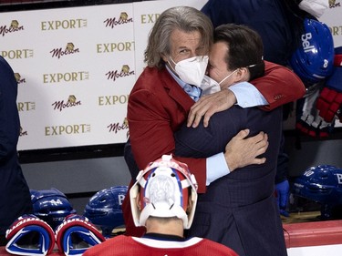 Montreal Canadiens general manager Marc Bergevin congratulates assistant coach Luke Richardson after the Canadiens defeated the Vegas Knights to advance to the Stanley Cup final during NHL semi final game 6  in Montreal on Thursday, June 24, 2021.