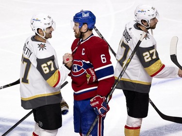 Vegas Golden Knights left wing Max Pacioretty (67) congratulates Montreal Canadiens defenseman Shea Weber (6)  after the Canadiens defeated the Vegas Knights to advance to the Stanley Cup final during NHL semi final game 6  in Montreal on Thursday, June 24, 2021.