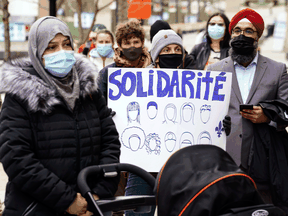 People take part in a demonstration following a Superior Court ruling on Bill 21, Quebec's secularism law, in Montreal on Tuesday, April 20, 2021.