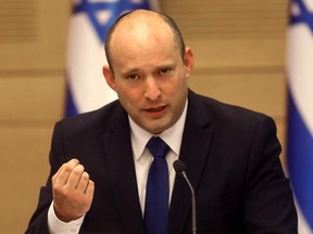Israel's incoming prime minister Naftali Bennett gives an address before the new cabinet at the Knesset in Jerusalem on June 13, 2021.