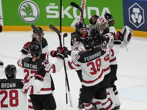 Team Canada celebrates after beating Team USA 4-2 at the IIHF world championship in Riga, Latvia, on Saturday, June 5, 2021.