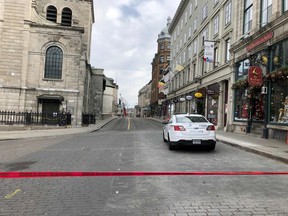 Police cars close a street in Old Quebec after the Oct 31, 2020 sword attacks.