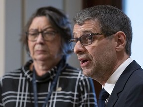 Conservative Party of Quebec Leader Éric Duhaime speaks at a news conference on Friday at the National Assembly in Quebec City. After being booted from the CAQ this week, MNA Claire Samson announced she was joining his party.