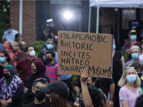 People attend a vigil organised after four members of a Muslim family were killed in what police describe as a hate-motivated attack at London Muslim Mosque in London, Ontario, Canada, June 8, 2021. REUTERS/Carlos Osorio