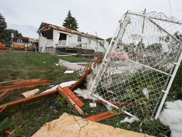 Homes are seen damaged by a tornado that touched down on the previous day in Mascouche June 22, 2021.