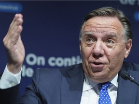 Quebec Premier François Legault responds to a question during a news conference in Montreal on Tuesday, June 22, 2021.