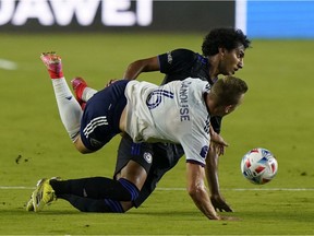 D.C. United midfielder Russell Canouse and CF Montréal midfielder Ahmed Hamdi collide during Wednesday night's game in Fort Lauderdale, Fla.