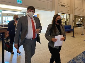 Intergovernmental Affairs Minister Dominic LeBlanc and MP Jenica Atwin arrive at a news conference in Fredericton, Thursday, June 10, 2021. Atwin announced she was leaving the Green Party to join the Liberals.