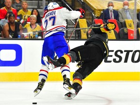 Canadiens defenceman Alexander Romanov (27) checks Vegas Golden Knights defenceman Alex Pietrangelo (7) during the first period of Game 1 of the 2021 Stanley Cup Semifinals at T-Mobile Arena in Las Vegas on Monday, June 14, 2021.