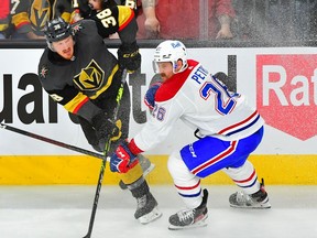 Golden Knights' Patrick Brown shoots the puck past Canadiens defenceman Jeff Petry during second period Wednesday night in Las Vegas.