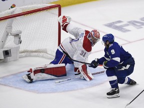 Canadiens goaltender Carey Price robs Lightning centre Tyler Johnson of a goal during second-period action at Amalie Arena Monday night.
