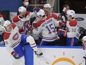 Montreal Canadiens defenceman Jeff Petry (26) and Brett Kulak (77) and Joel Edmundson (44) and Erik Gustafsson (32) celebrate with forward Jesperi Kotkaniemi (15) after defeating Toronto Maple Leafs 3-1 in game seven of the first round of the 2021 Stanley Cup Playoffs at Scotiabank Arena.