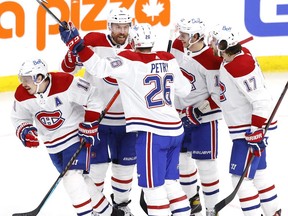 Montreal Canadiens right wing Brendan Gallagher (11) celebrates his first period goal with teammates against the Winnipeg Jets in game one of the second round of the 2021 Stanley Cup Playoffs at Bell MTS Place. Mandatory Credit: James Carey Lauder-USA TODAY Sports