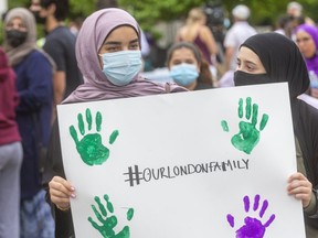 Mariam Boroot and Aya Abdul Hamid join a demonstration in London, Ont., after a Muslim family was killed in an apparent hate attack. The girls
were close friends of 15-year-old Yumnah Afzaal.