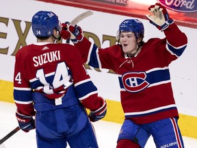 Montreal Canadiens right-wing Cole Caufield celebrates centre Nick Suzuki's goal against the Toronto Maple Leafs in Montreal on April 28, 2021.