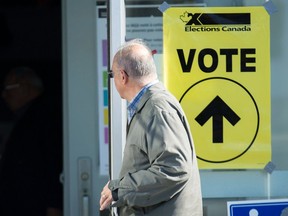 A man arrives to cast his ballot at a polling station on federal election day in Shawinigan, Que., Monday, Oct. 21, 2019.