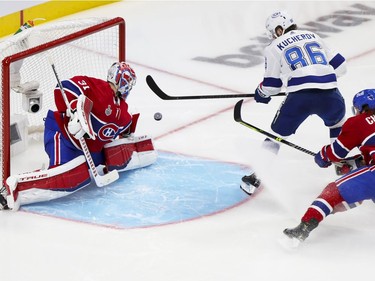 Tampa Bay Lightning's Nikita Kucherov shoots the puck past Canadiens' Carey Price and defenceman Ben Chiarot for a goal during the second period of the Stanley Cup Final in Montreal on Friday, July 2, 2021.
